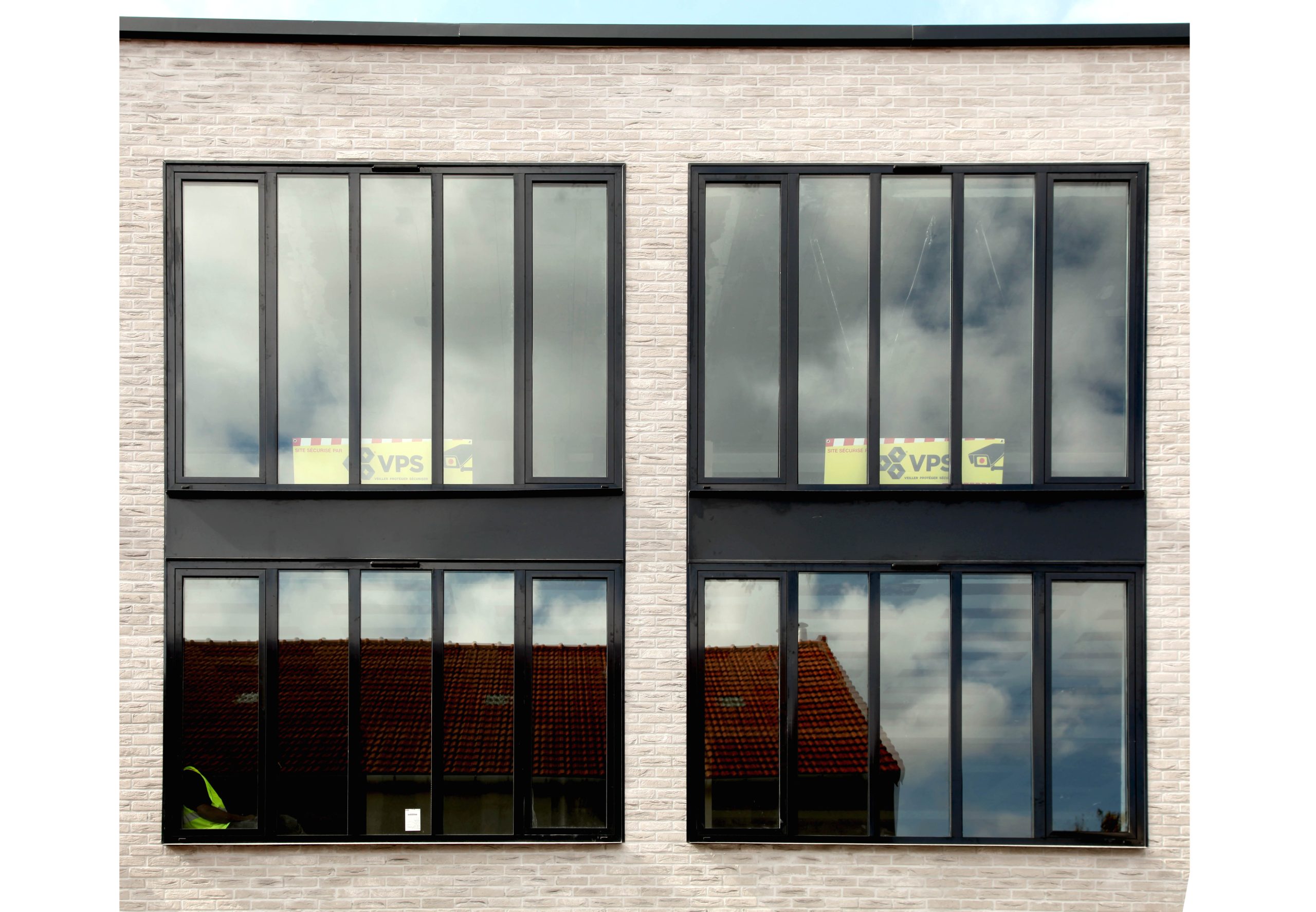 Réhabilitation et transformation d'un immeuble de bureau en 4 lofts  Modification façade rue et cour Réfection parties communes
